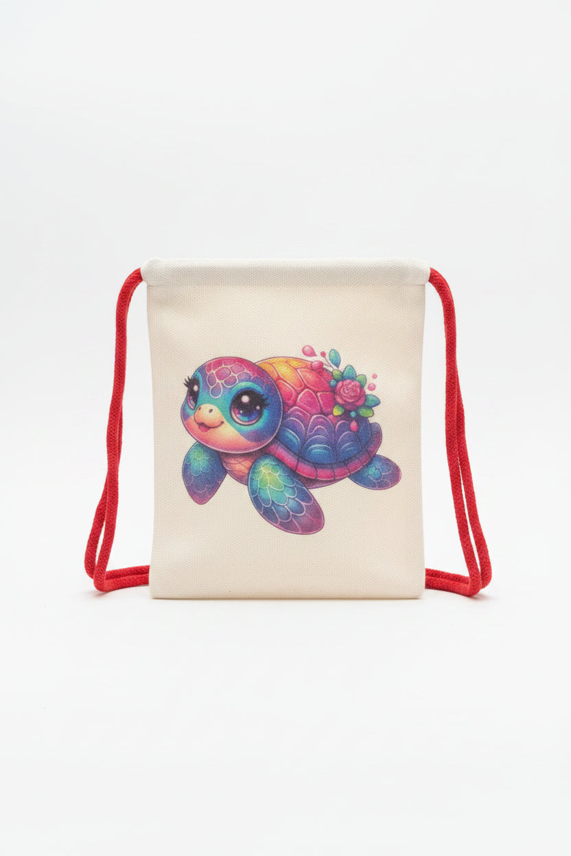 A cream-colored canvas drawstring bag featuring a colorful, cartoon-style sea turtle illustration with a pink rose on its shell, resting on a gray fabric surface.