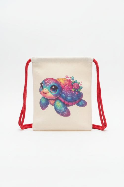 A cream-colored canvas drawstring bag featuring a colorful, cartoon-style sea turtle illustration with a pink rose on its shell, resting on a gray fabric surface.