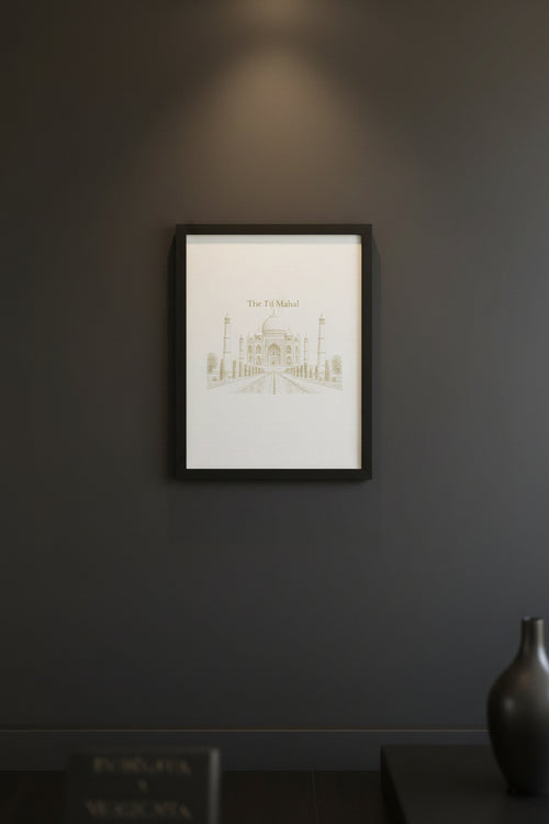 A square art print featuring a sepia line drawing of The Taj Mahal, displayed on a textured gray fabric surface.